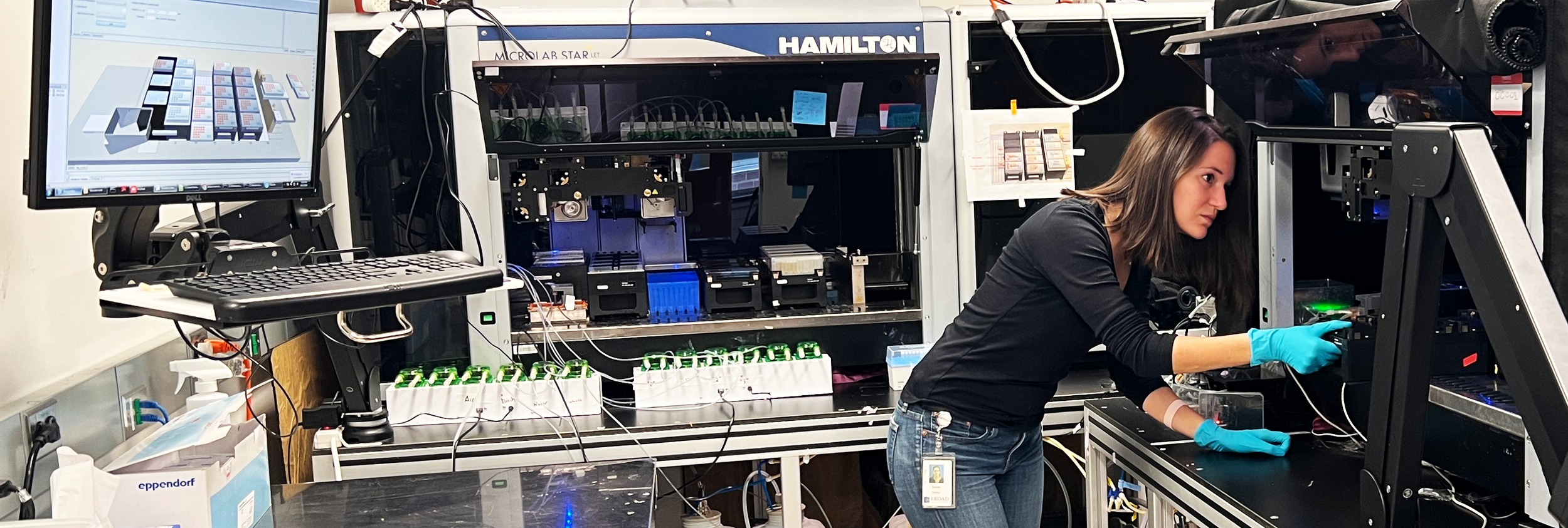 Emma Chory working at the lab's Hamilton liquid handler